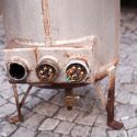 A rusted, old water tank being replaced by C. Woods Company in Tyler, TX.