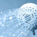 A shower head with running water installed by a plumber from C. Woods Company in Tyler, TX