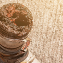 A rusted piece of plumbing beign replaced by the plumbers at C. Woods Company in Tyler, TX.